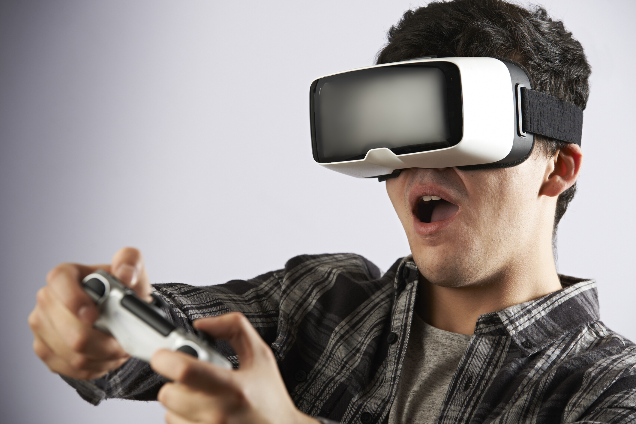 Man Playing Video Game Wearing Virtual Reality Headset